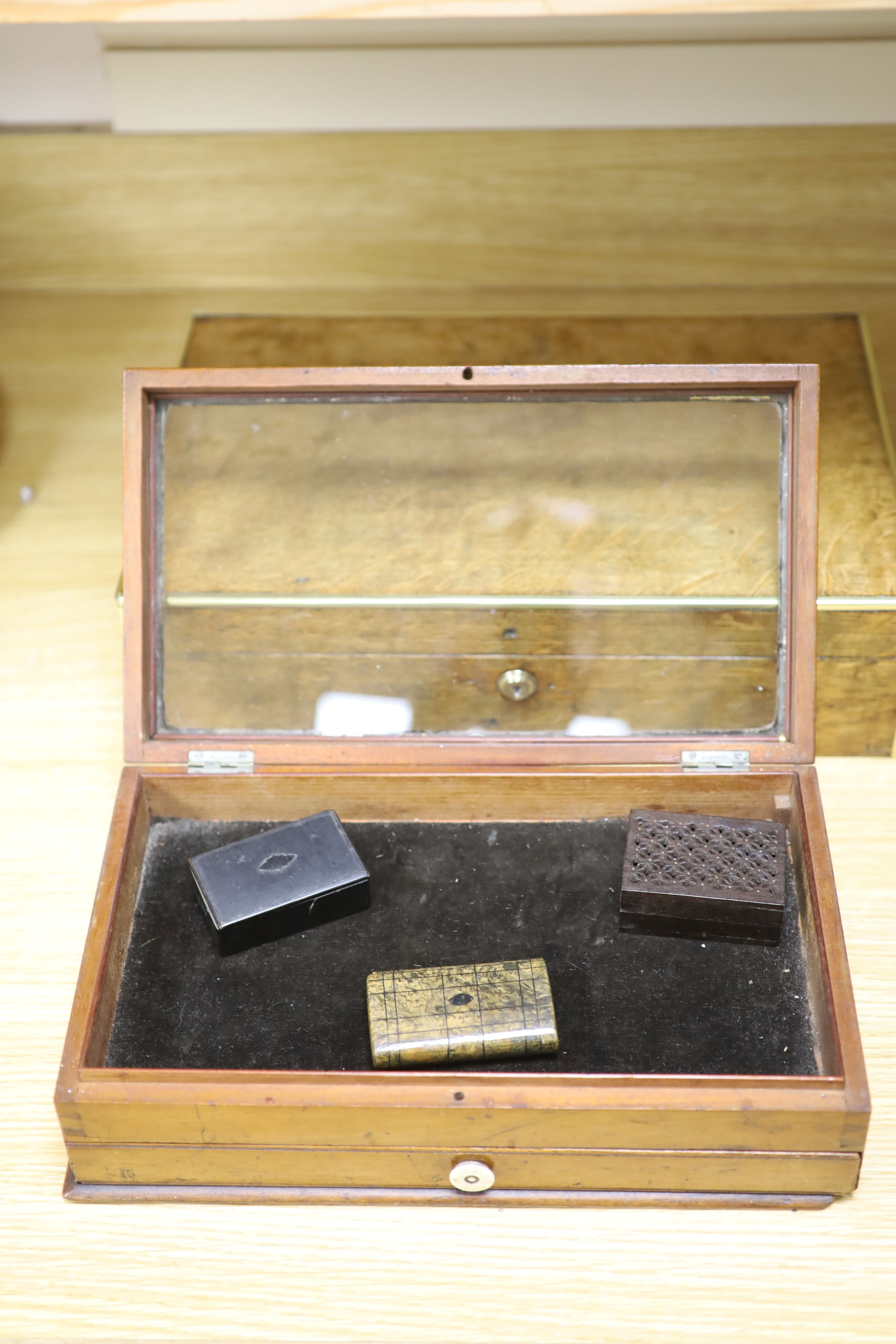 A display box, three snuff boxes, a Victorian brass bound oak document box and a coromandel box